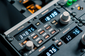 A detailed shot of the control and navigation panel in the cockpit of a Boeing 737 Flight Simulator passenger plane
