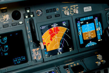 A detailed shot of the radar control and navigation panel in the cockpit of the Boeing 737 Flight...