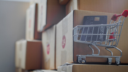 Entrepreneurs Small Business SME Independent men work at home Use smartphones and laptops for commercial checking, online marketing, packing boxes, SME sellers, concept, e-commerce tea