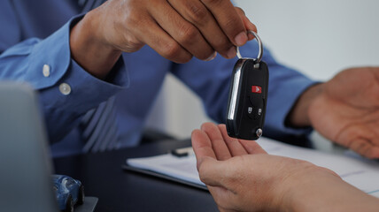 Real estate brokers are shaking hands to congratulate buyers after agreeing to insure and buy a...