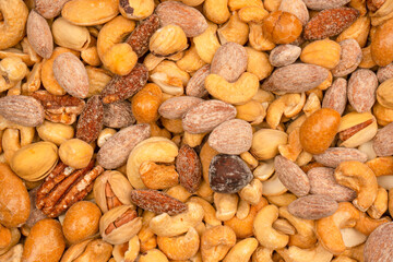 A group of almonds, pistachios, walnuts, macadamia, cashews.