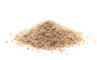 Hazelnuts ground pile isolated on white, side view