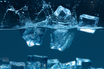 ice cubes falling on cold water