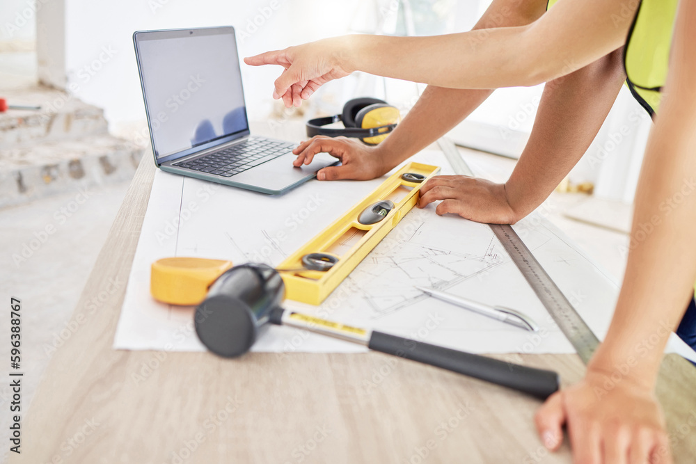 Poster Can we go with this design. Cropped shot of two unrecognisable contractors standing inside together and using a laptop while planning.