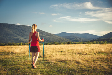 Young woman n the top of the mountains