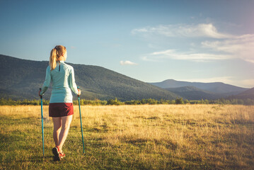 Young woman n the top of the mountains