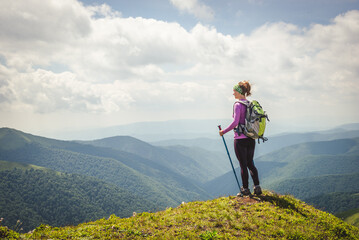 Young woman n the top of the mountains