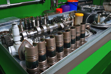 car fuel pump repair, repair parts and accessories, workbench in workshop, truck service, close-up