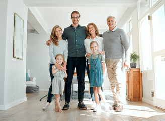 We love spending time as a family. Full length shot of a family standing together during a relaxing...