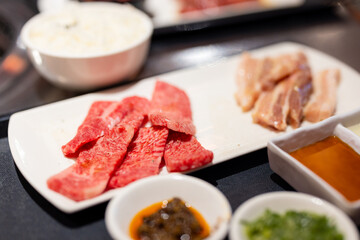 Slice of fresh beef meat in Japanese grill restaurant