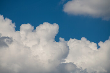 Fototapeta na wymiar Beautiful huge fluffy clouds on the blue sky. Sky clouds background.