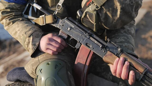 Ukrainian army, Kalashnikov rifle, close-up of the barrel, shadow 