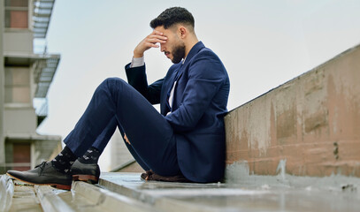 This might be the end. Shot of a young businessman looking stressed out.