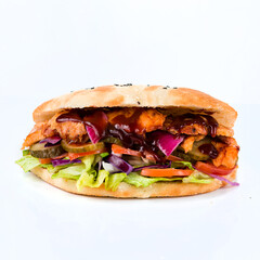 Flatbread with tomatoes, chicken, lettuce, cheese, pickled cucumbers, cabbage and barbecue sauce on white background.