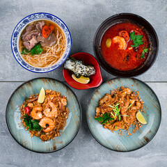 Set of Ramen soup with noodles and beef, red spicy soup with shrimp, pasta with chicken, shrimp.