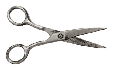 Old retro rusty tailor's scissors on a white background. Sewing accessories