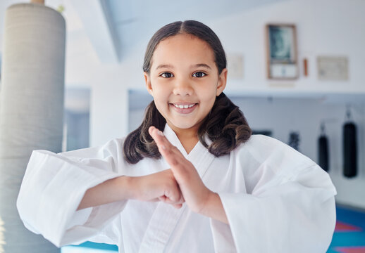 This is what I learnt in karate class. Shot of a cute little girl practicing karate in a studio.