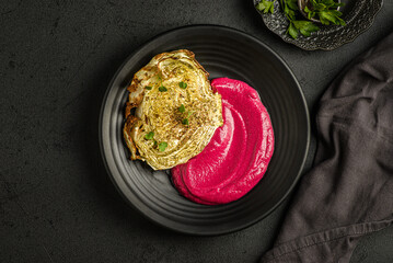beetroot mousse in a black plate