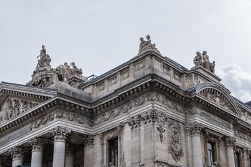 Architectural fragment of Brussels Stock Exchange building (BeursBourse) on the Place de la Bourse. The building erected from 1868 to 1873 in the Neo-Renaissance style. Brussels, Belgium.