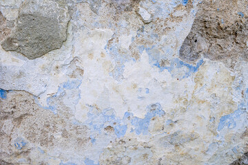 Texture of old, cracked, peeling walls. Background of blue, white walls