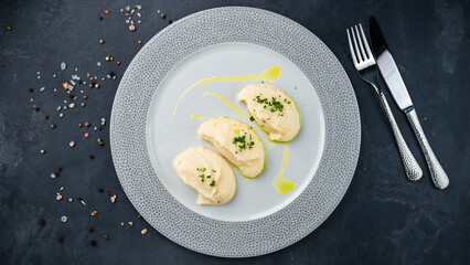 Mashed potatoes with greens on plate.
