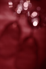 Wine glasses defocused, red wine color blurred background with light flare, optical blur, bokeh. Top view aesthetic still life photo alcoholic drinks art styles for winery, wine list