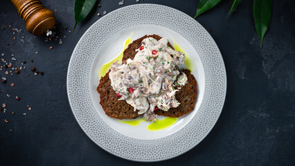 Potato pancakes with beef, onions and sour cream.