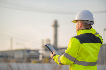 Asian man petrochemical engineer working at oil and gas refinery plant industry factory,The people worker man engineer work control at power plant energy industry manufacturing
