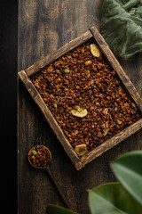 granola on a dark wooden background