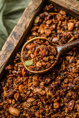 granola on a dark wooden background