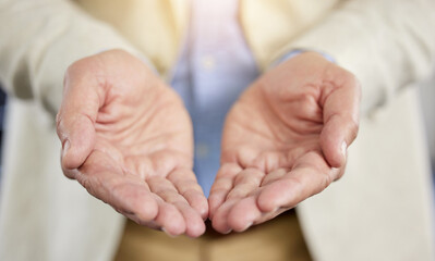 Knowledge is meant to be shared. Cropped shot of an unrecognisable businessman standing alone with his hands open in a receiving gesture.