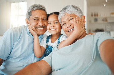 Being part of a family means smiling for photos. Shot of grandparents bonding with their...