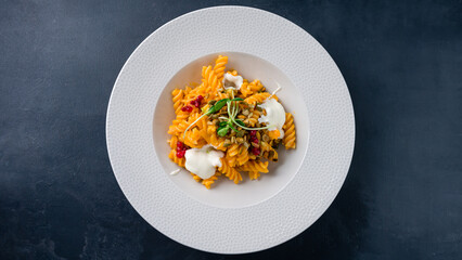 Italian lunch pasta with cranberries, sauce, microgreens and seeds.