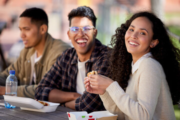 Its chow time. Shot of a group of students having a quick bite while studying together.