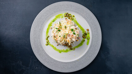 Salad with cabbage, crab sticks, corn, egg, cheese and mayonnaise on a slice of bread.