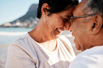 Cherish the ones you love. Shot of a mature couple spending time at the beach.