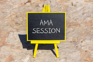 AMA ask me anything session symbol. Concept words AMA ask me anything session on black chalk blackboard on a beautiful stone background. Business and AMA ask me anything session concept. Copy space.