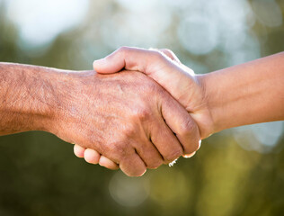 Were invincible when were together. Shot of two unrecognisable men shaking hands outdoors.