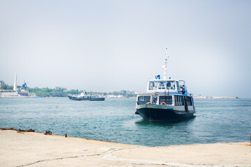 Sea transport moves in the sea bay.