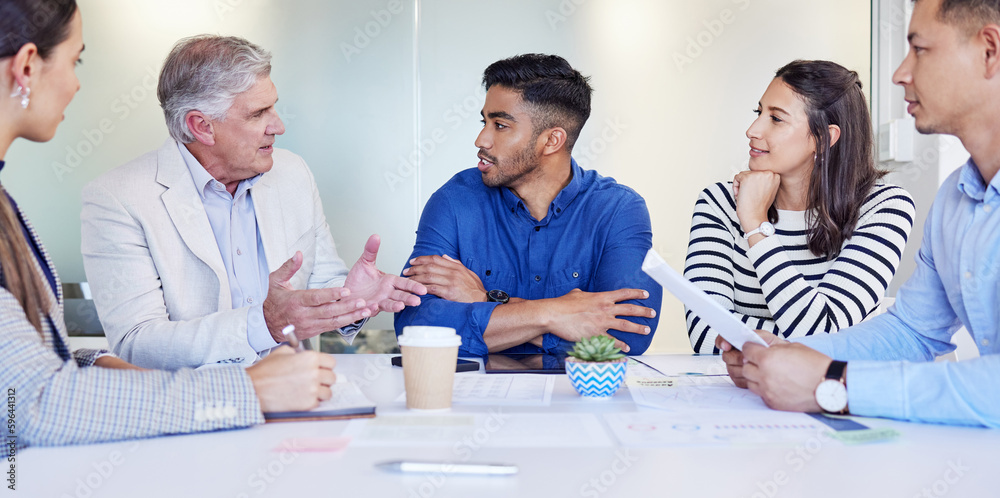 Poster lets get on the same page. shot of a group of businesspeople having a meeting at work.