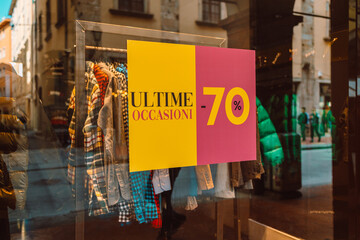 Picture of shop window display with text Sale on banner poster. High quality photo