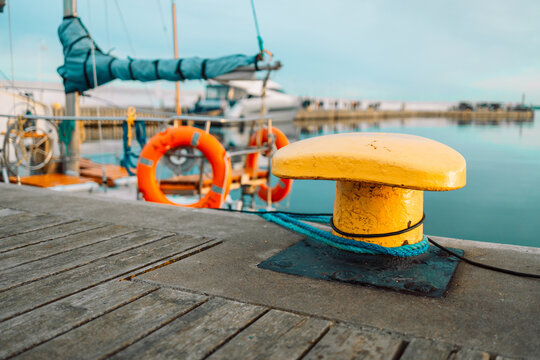 Mooring bollard with a fixed rope on the ship. High quality photo