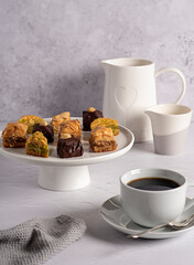Food photography of baklava, dessert, pastry, traditional, greek, turkish, sweet, sugar, syrup, nut, chocolate, hazelnut, pistachio, tea, coffee