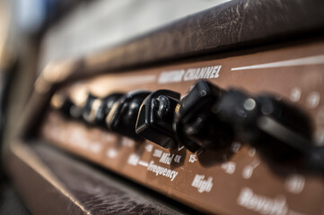 Electric guitar amplifier device leather-covered