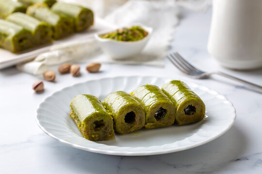 Pistachio baklava. Traditional Middle Eastern Flavors. The local name of Baklava is Fıstıklı Baklava or fıstıklı dolama. Turkish style pistachio baklava presentation and service