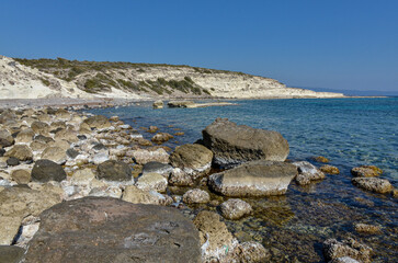 Fototapeta na wymiar cove with crystal clear water on Alacati coast near Gilikli beach (Cesme, Izmir province, Turkey) 