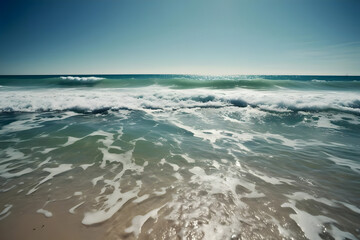 The sparkling blue ocean, with its waves crashing against the sandy shore and the warm sun shining overhead, is a sight that embodies the essence of summer