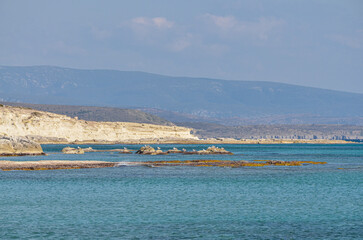sandstone cliffs and reefs of Alacati coast scenic view from Gilikli beach (Cesme, Izmir province, Turkey) 