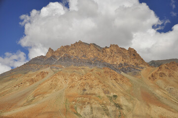 Brown rocky mountain with cloudy sky on the way of Darcha-Padum road, Ladakh, INDIA 