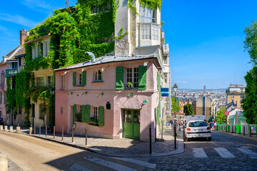 Cozy street in quarter Montmartre in Paris, France. Architecture and landmark of Paris. Cozy Paris cityscape.